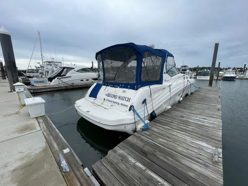 Slide: The Image of 2003 Sea Ray 340 Sundancer docked at marina with blue canopy. - 3