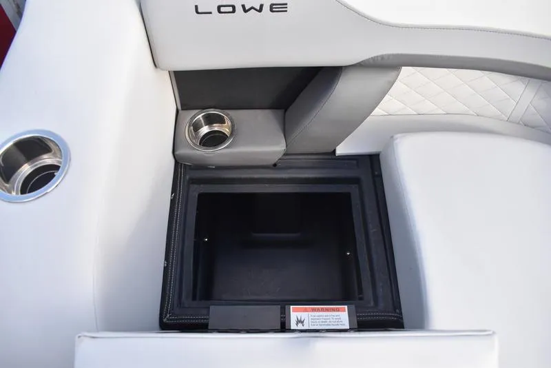 Slide: The Image of 2023 Lowe SS 210 DL boat storage compartment with cushioned seating and quilted design. - 10
