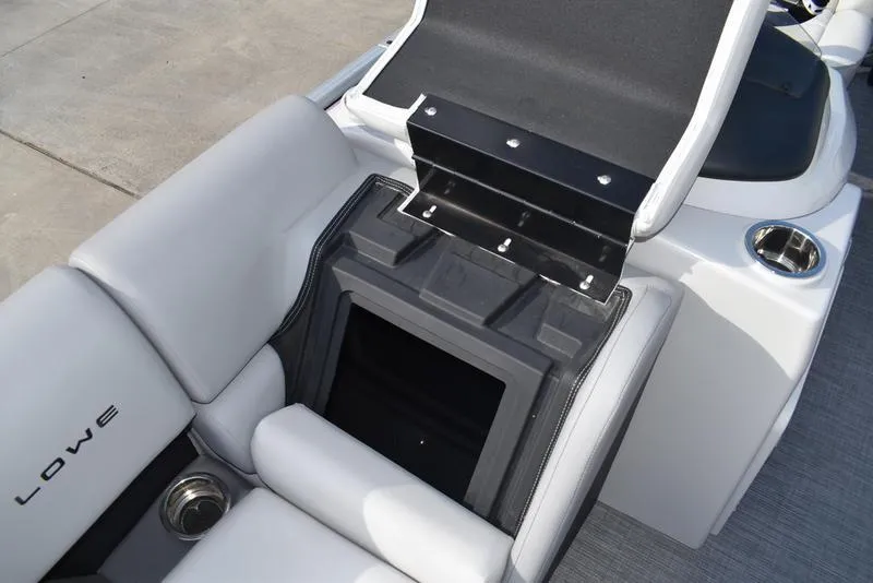 Slide: The Image of 2023 Lowe SS 210 DL boat interior with table and seating arrangement. - 16