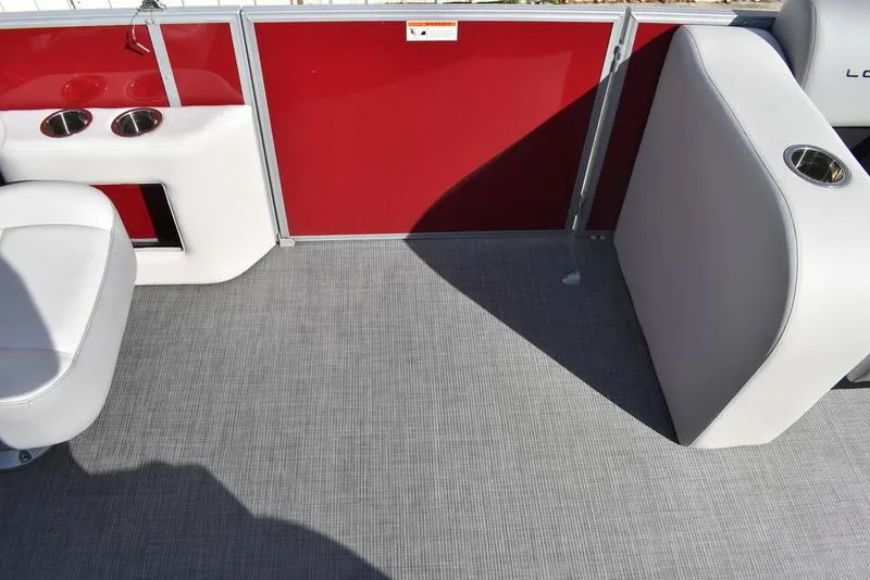 Slide: The Image of Interior of 2023 Lowe SS 210 DL boat with red paneling and gray flooring. - 17