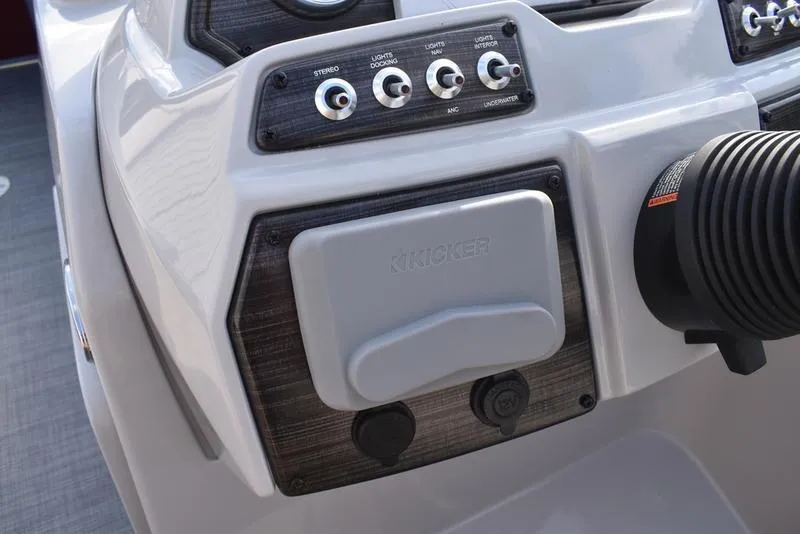 Slide: The Image of 2023 Lowe SS 210 DL boat dashboard with steering wheel and control panel. - 19