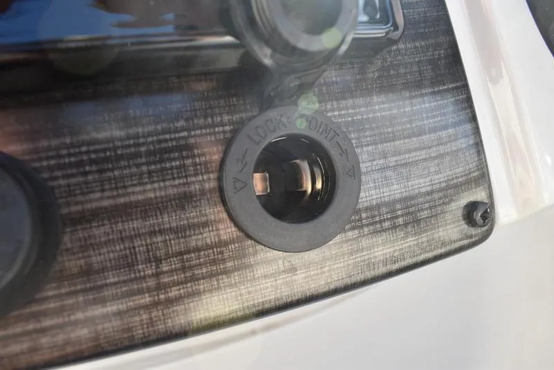 Slide: The Image of 2023 Lowe SS 210 DL USB and 12V charging ports on dashboard. - 22