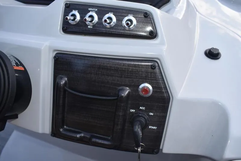 Slide: The Image of Close-up of 2023 Lowe SS 210 DL tachometer displaying RPM gauge. - 26