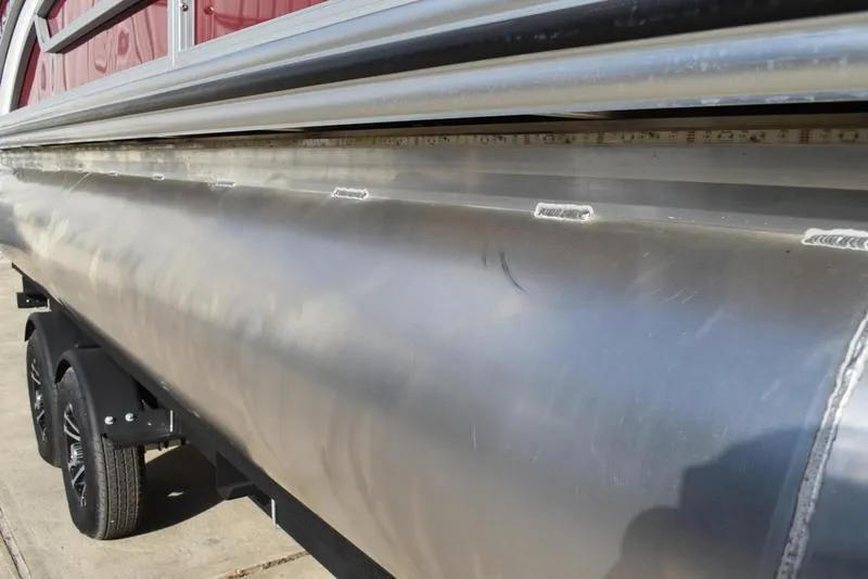 Slide: The Image of 2023 Lowe SS 210 DL pontoon boat close-up, showcasing sleek aluminum construction. - 3