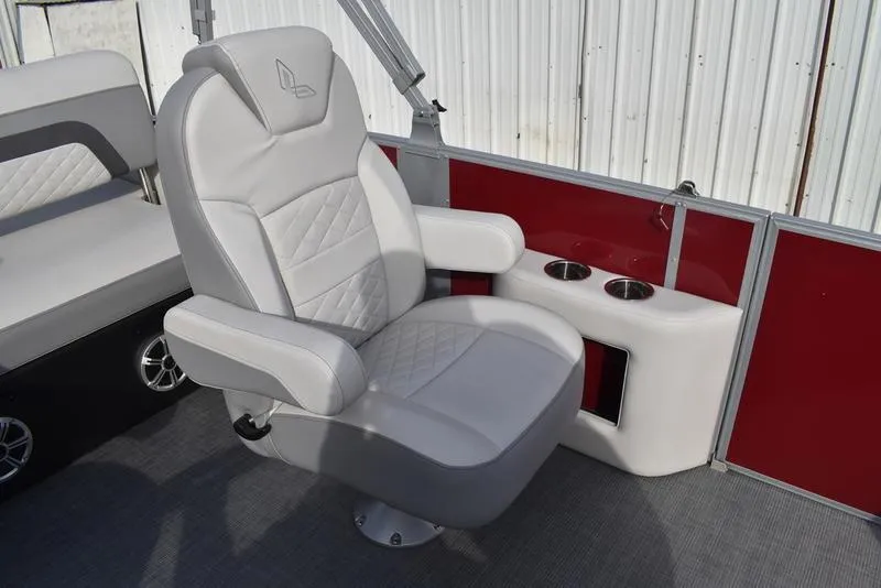 Slide: The Image of 2023 Lowe SS 210 DL boat seat with cup holders, red paneling, and quilted design. - 31