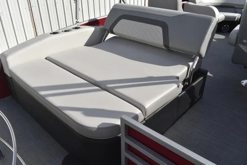 Slide: The Image of 2023 Lowe SS 210 DL boat interior with gray cushioned seating and cup holders. - 36