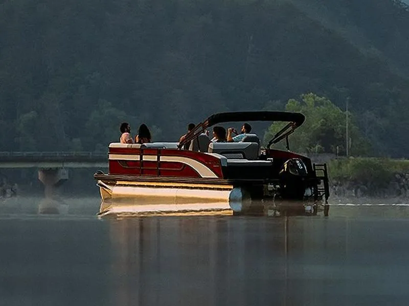 Slide: The Image of 2023 Lowe SS 210 DL boat storage compartment with cushioned seating and metal railing. - 38