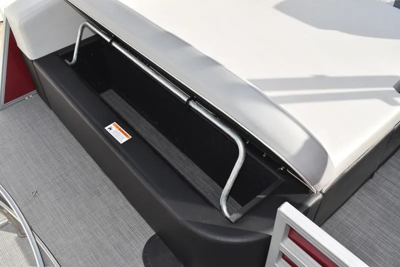 Slide: The Image of 2023 Lowe SS 210 DL boat interior with red paneling and cup holders. - 40