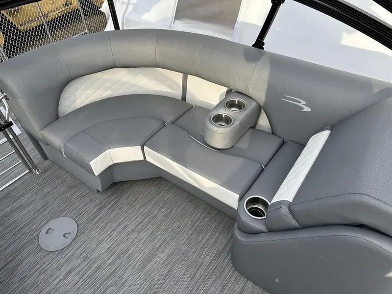 Slide: The Image of 2021 Bennington 22 LFB boat interior with gray seating and cup holders. - 10