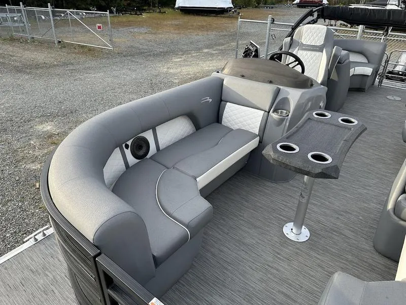 Slide: The Image of 2021 Bennington 22 LFB pontoon boat interior with gray seating and cup holders. - 6