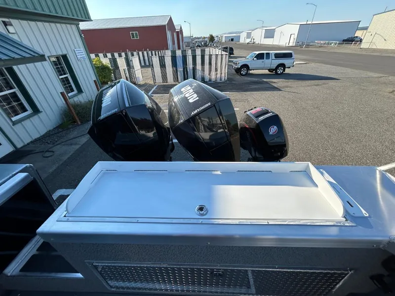 Slide: The Image of 2025 Thunder Jet Alexis Pro XL 26' boat with powerful outboard motors in a marina setting. - 13