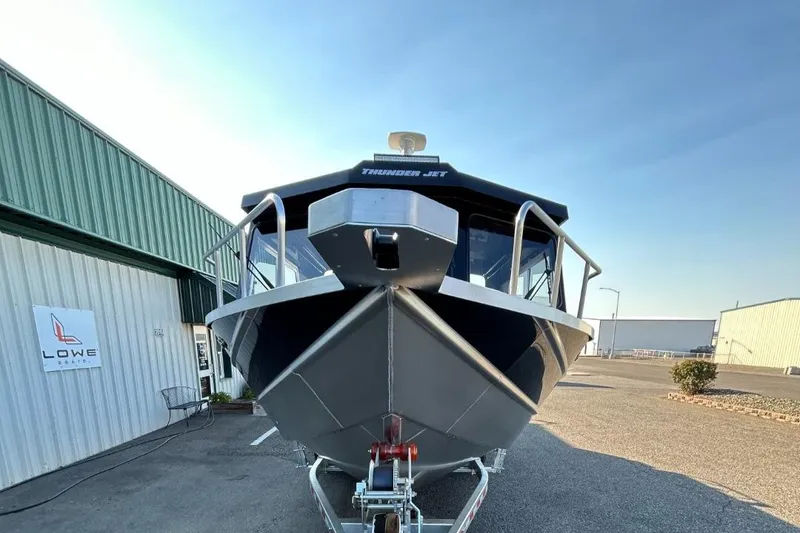 Slide: The Image of 2025 Thunder Jet Alexis Pro XL 26' boat on trailer, front view. - 27