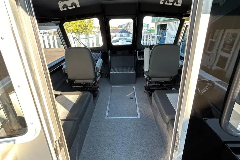 Slide: The Image of Interior of 2025 Thunder Jet Alexis Pro XL 26' boat, featuring spacious seating and modern design. - 30