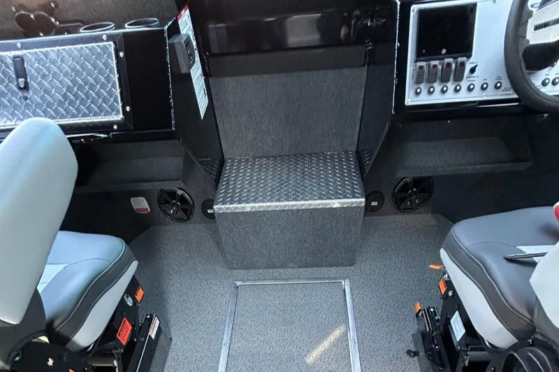 Slide: The Image of Interior of 2025 Thunder Jet Alexis Pro XL 26' boat, featuring seating and control panel. - 31