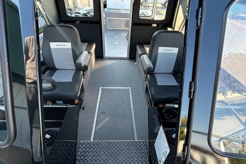 Slide: The Image of Interior of 2025 Thunder Jet Alexis Pro XL 26' boat with seating and modern design. - 34