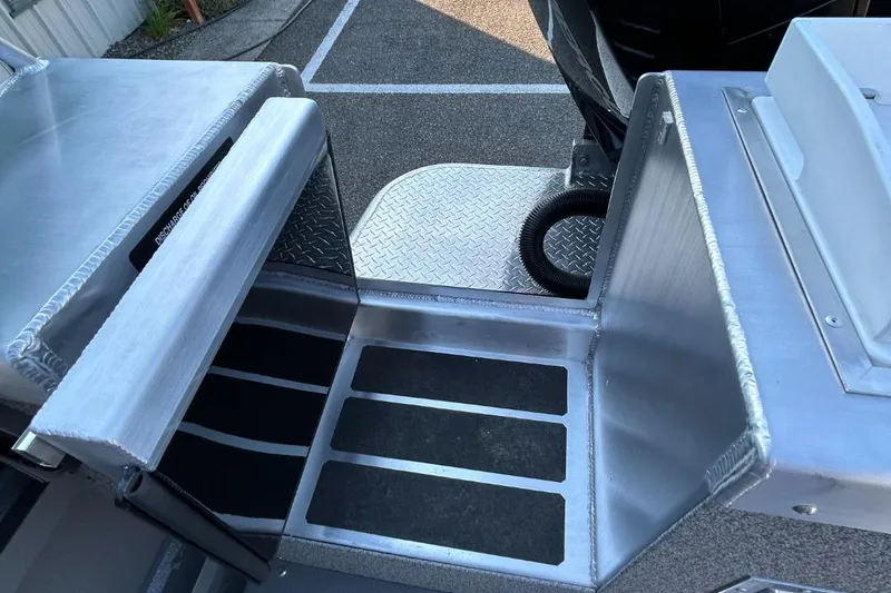 Slide: The Image of Interior view of 2025 Thunder Jet Alexis Pro XL 26' boat with aluminum flooring. - 38