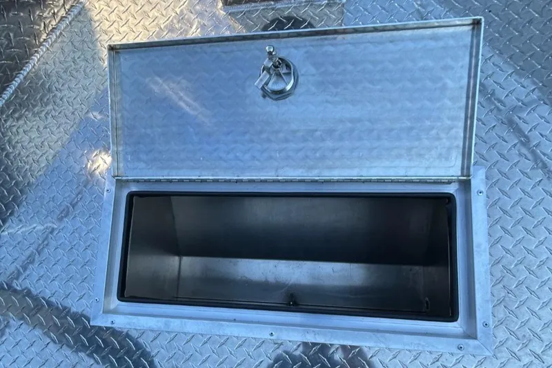 Slide: The Image of Open storage compartment on 2025 Thunder Jet Alexis Pro XL 26' boat. - 42