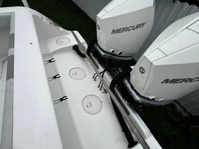 Slide: The Image of 2020 Mako 284 CC boat with dual Mercury outboard engines. - 11
