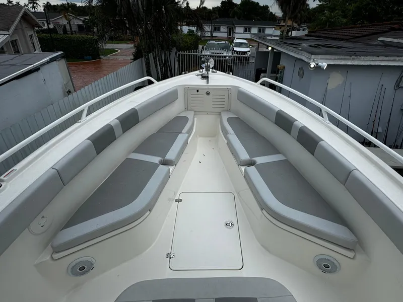 Slide: The Image of 2020 Mako 284 CC boat with spacious seating and sleek design. - 31