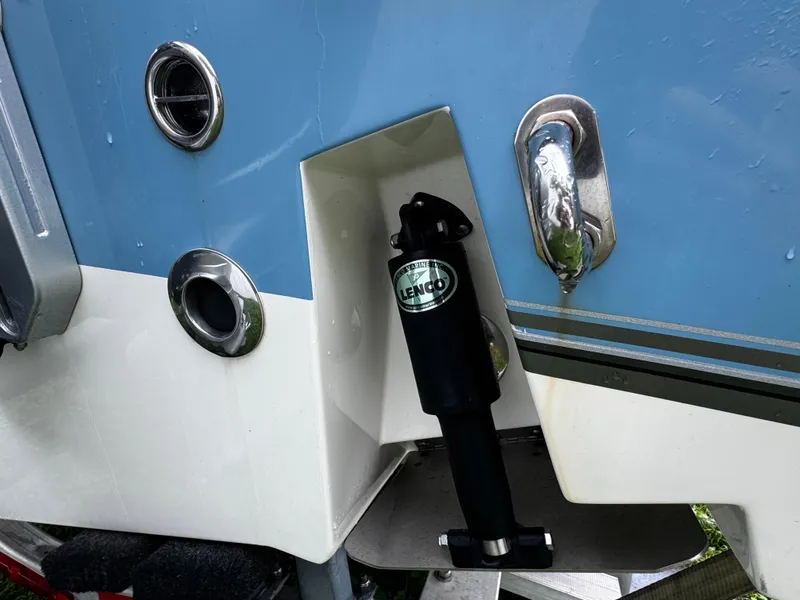 Slide: The Image of 2020 Mako 284 CC boat with Lenco trim tab actuator detail. - 5