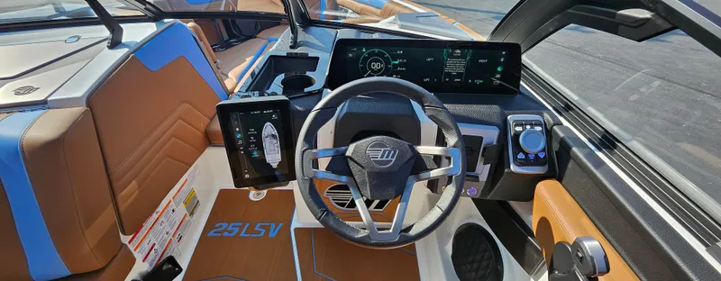 Slide: The Image of 2025 Malibu 25LSV boat dashboard with modern controls and digital displays. - 20
