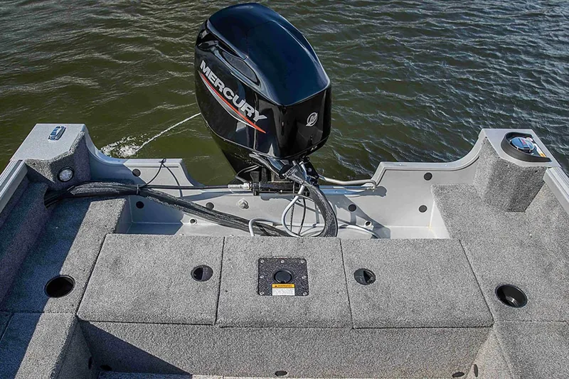 Slide: The Image of 2024 Alumacraft Classic 165 Tiller boat with Mercury outboard engine on water. - 23