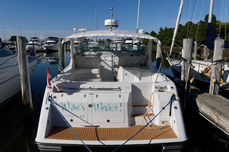 Slide: The Image of 1992 Regal Commodore 402 yacht docked at marina, rear view. - 2