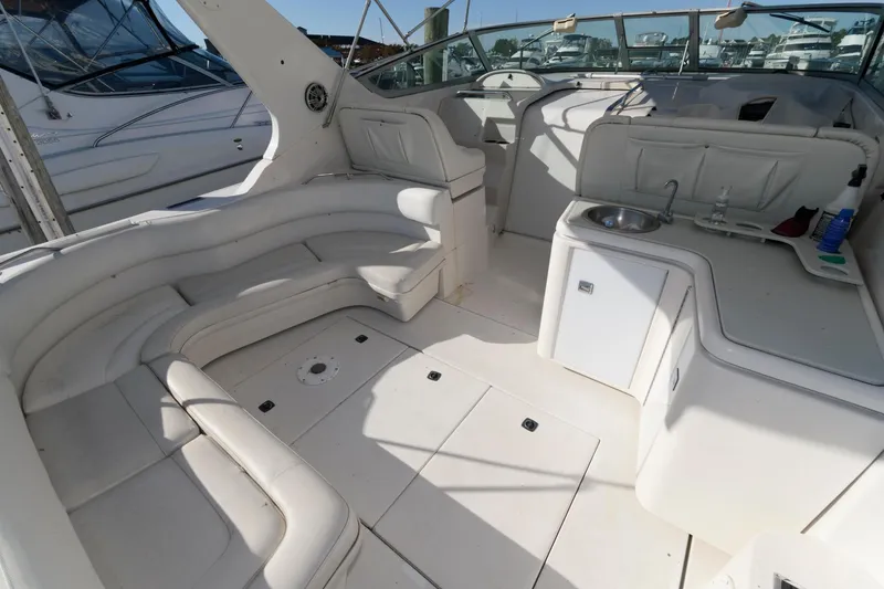 Slide: The Image of Spacious interior of 1992 Regal Commodore 402 yacht with white seating and kitchenette. - 4