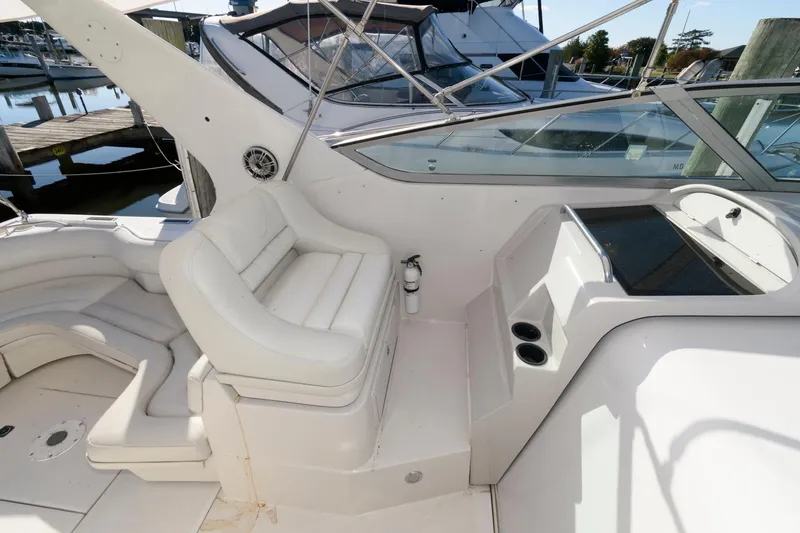 Slide: The Image of 1992 Regal Commodore 402 yacht interior with white seating and control panel. - 6