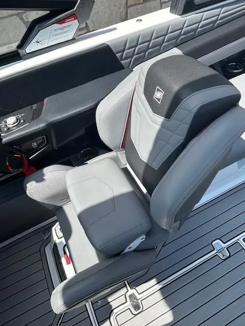 Slide: The Image of 2022 Nautique G23 boat interior with luxurious gray seating and modern design. - 10