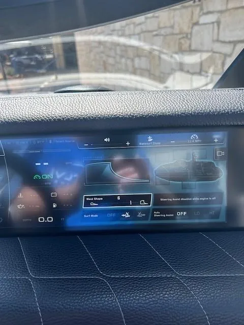Slide: The Image of 2022 Nautique G23 dashboard display showing wave shape and surf mode settings. - 17
