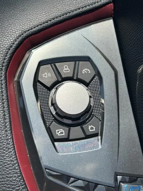 Slide: The Image of Control panel of a 2022 Nautique G23 boat with various function buttons. - 18