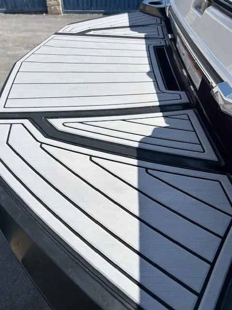 Slide: The Image of 2022 Nautique G23 boat deck with sleek, modern design and geometric patterns. - 21