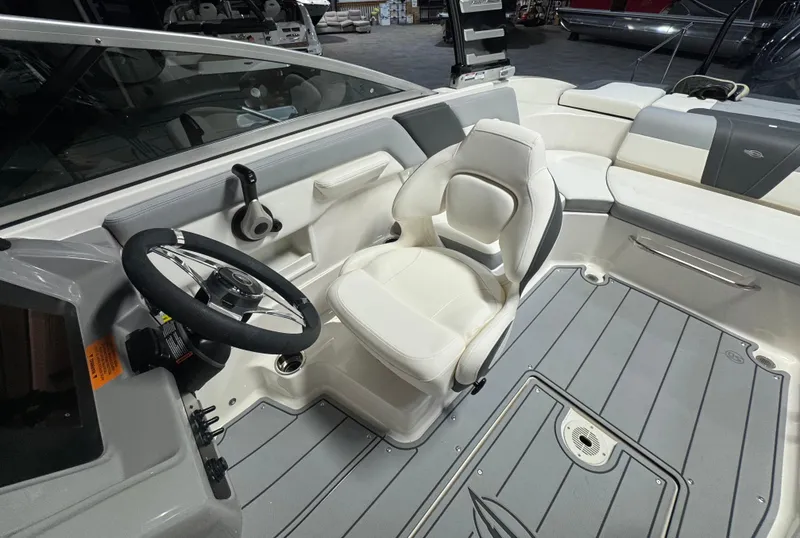 Slide: The Image of 2024 Chaparral 23 SSi OB boat interior with steering wheel and seating. - 16