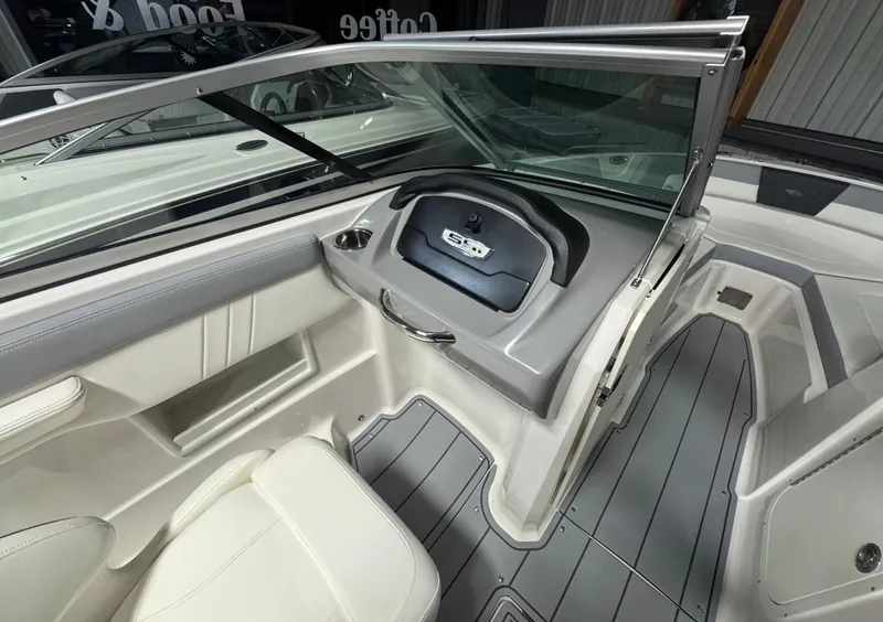 Slide: The Image of 2024 Chaparral 23 SSi OB boat interior with sleek design and modern dashboard. - 22