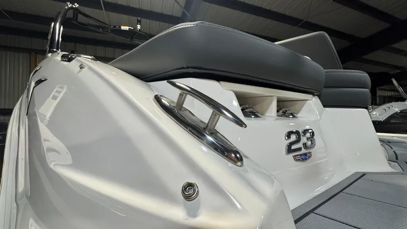 Slide: The Image of 2024 Chaparral 23 SSi OB boat, sleek design, close-up view of rear seating and details. - 28