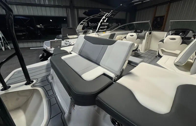 Slide: The Image of 2024 Chaparral 23 SSi OB boat interior with modern seating and sleek design. - 3
