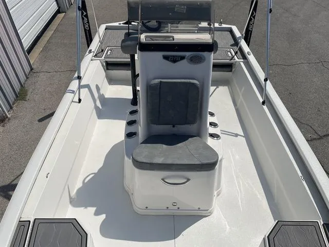 Slide: The Image of 2024 Avid 23 FSX boat interior with center console and seating. - 11