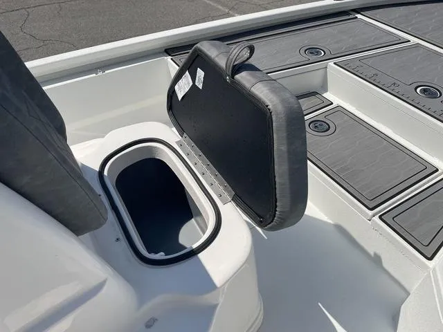 Slide: The Image of 2024 Avid 23 FSX boat storage compartment with open lid, showcasing interior space. - 12