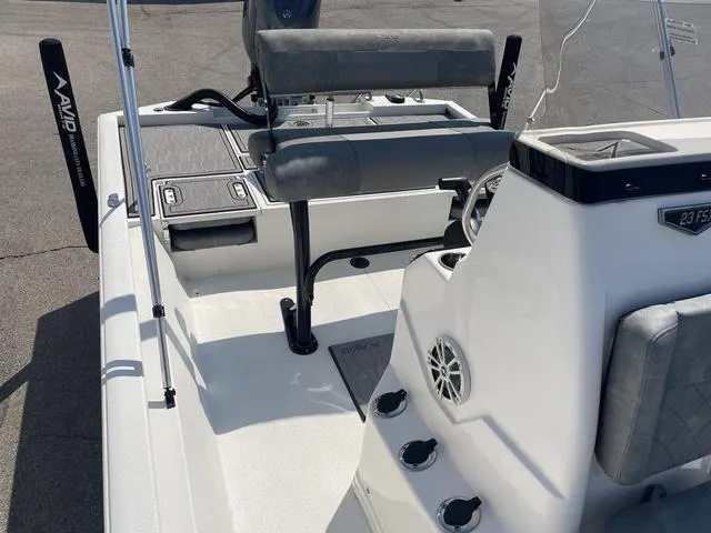Slide: The Image of 2024 Avid 23 FSX boat interior with seating and console details. - 14