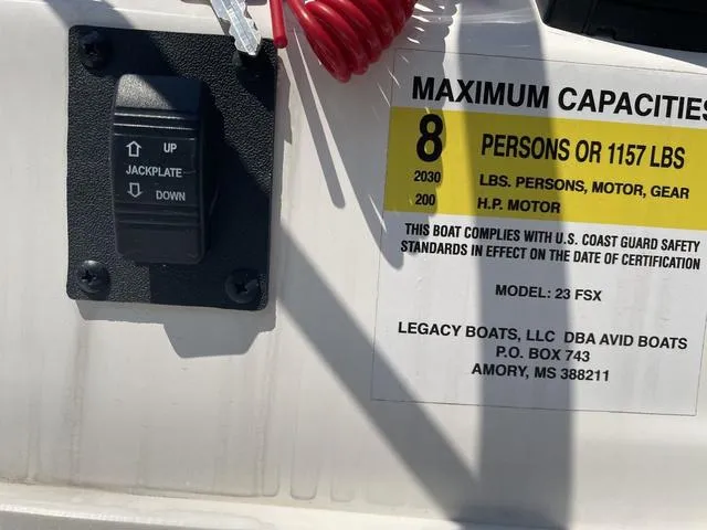 Slide: The Image of 2024 Avid 23 FSX boat capacity label, showing maximum weight and passenger limits. - 16