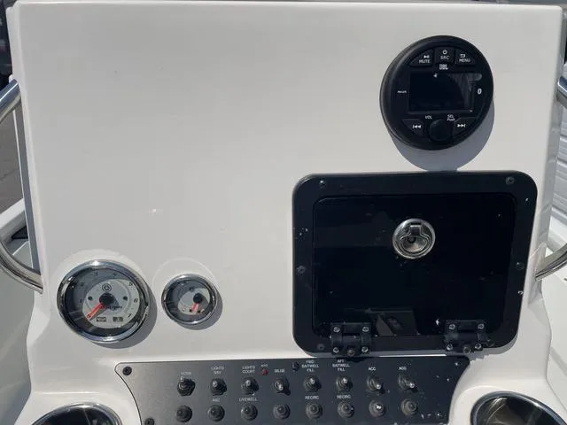 Slide: The Image of Dashboard of 2024 Avid 23 FSX boat with gauges and controls. - 17