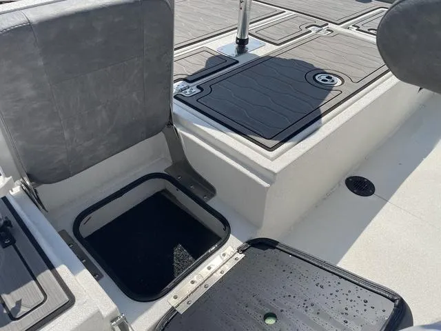Slide: The Image of 2024 Avid 23 FSX boat interior with open storage compartments. - 19