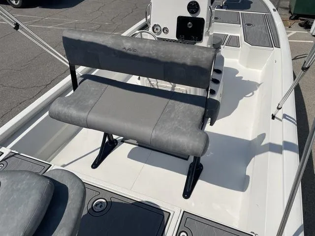 Slide: The Image of 2024 Avid 23 FSX boat interior with gray seating and control panel. - 21