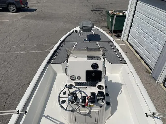 Slide: The Image of 2024 Avid 23 FSX boat interior with steering console and controls. - 22