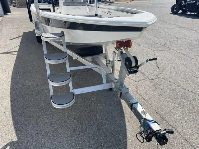 Slide: The Image of 2024 Avid 23 FSX boat on trailer with ladder and winch. - 5