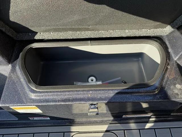 Slide: The Image of 2024 Bass Cat Puma STS boat dashboard with steering wheel and control panel. - 17