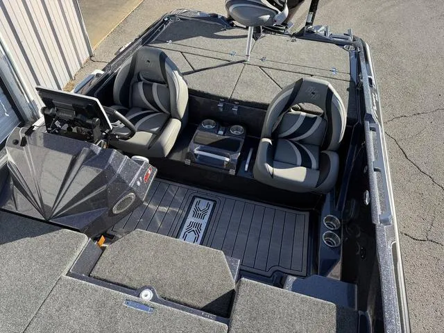 Slide: The Image of 2024 Bass Cat Puma STS boat interior with dual seats and cup holders. - 18