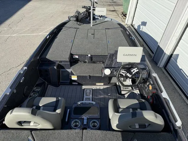 Slide: The Image of 2024 Bass Cat Puma STS interior with open storage compartments and seating. - 19