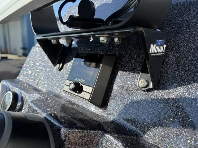 Slide: The Image of 2024 Bass Cat Puma STS dashboard with JL Audio system and mounting bracket. - 22